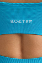 Define Luxe V-Neck Sports Bra in Turquoise Blue