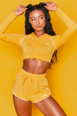 On Track Mini Runner Shorts in Orange