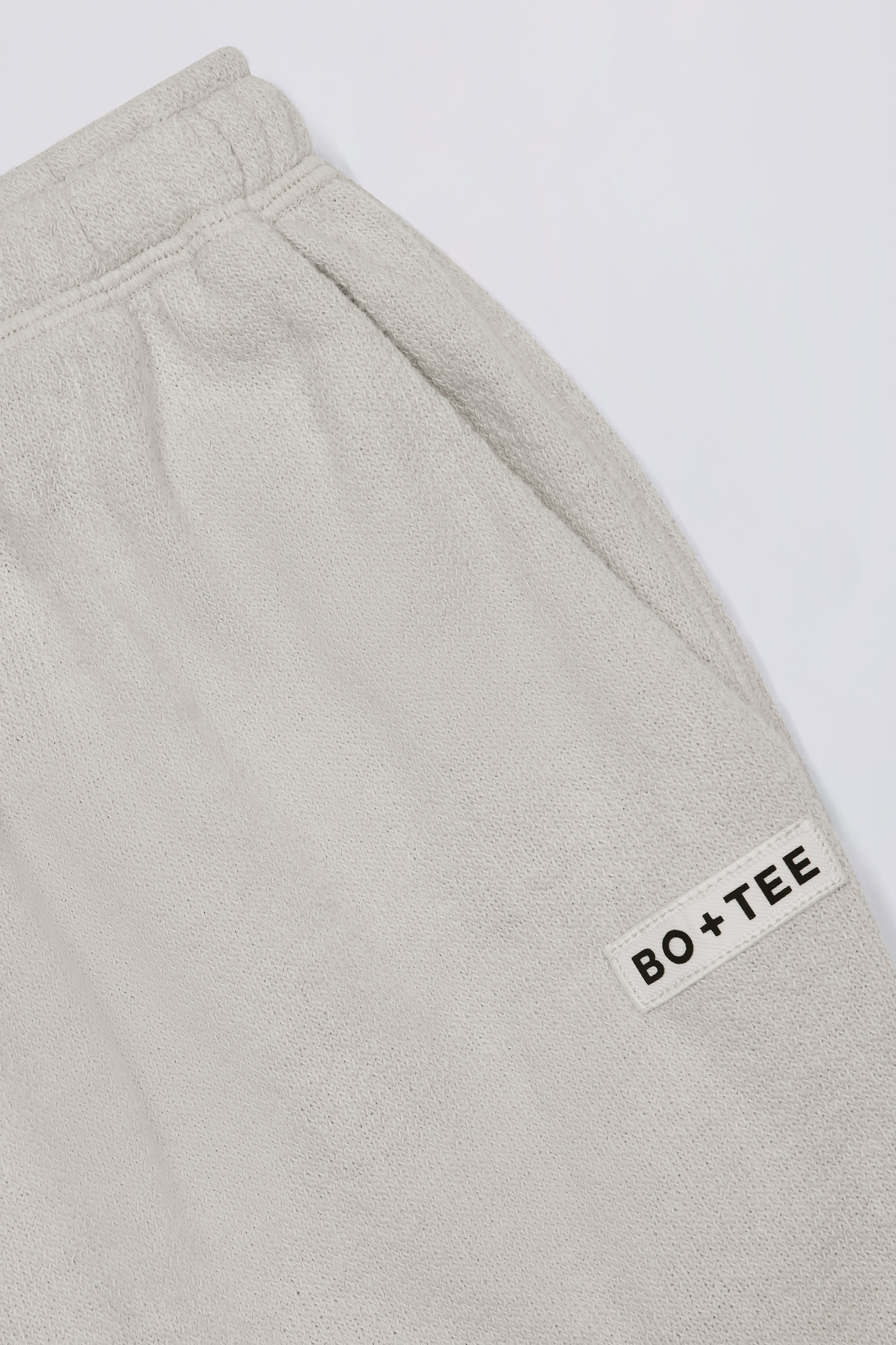 Button-Detail Low-Rise Wide-Leg Joggers in Light Grey