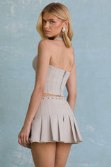 Low-Rise Pleated Mini Skirt in Ecru