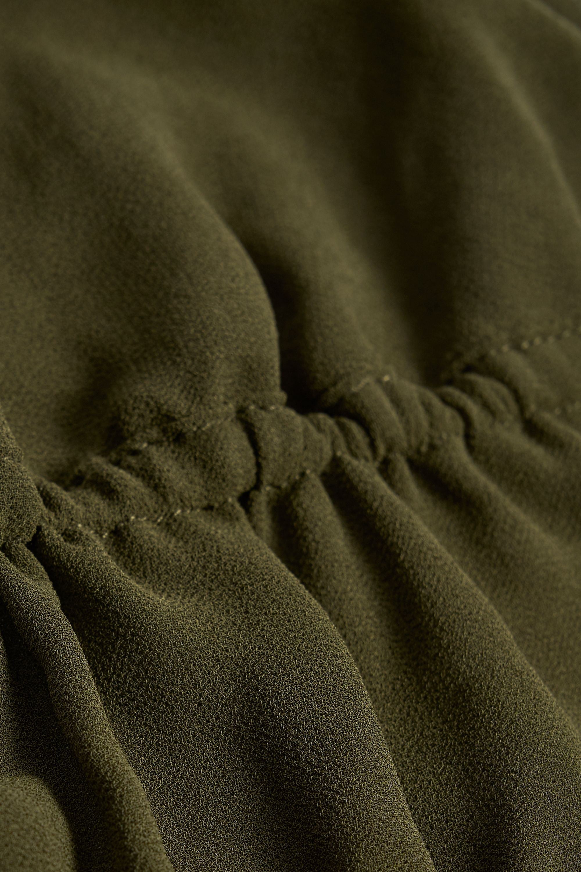 Cut-Out Semi-Sheer Ruched Halterneck Crop Top in Dark Khaki